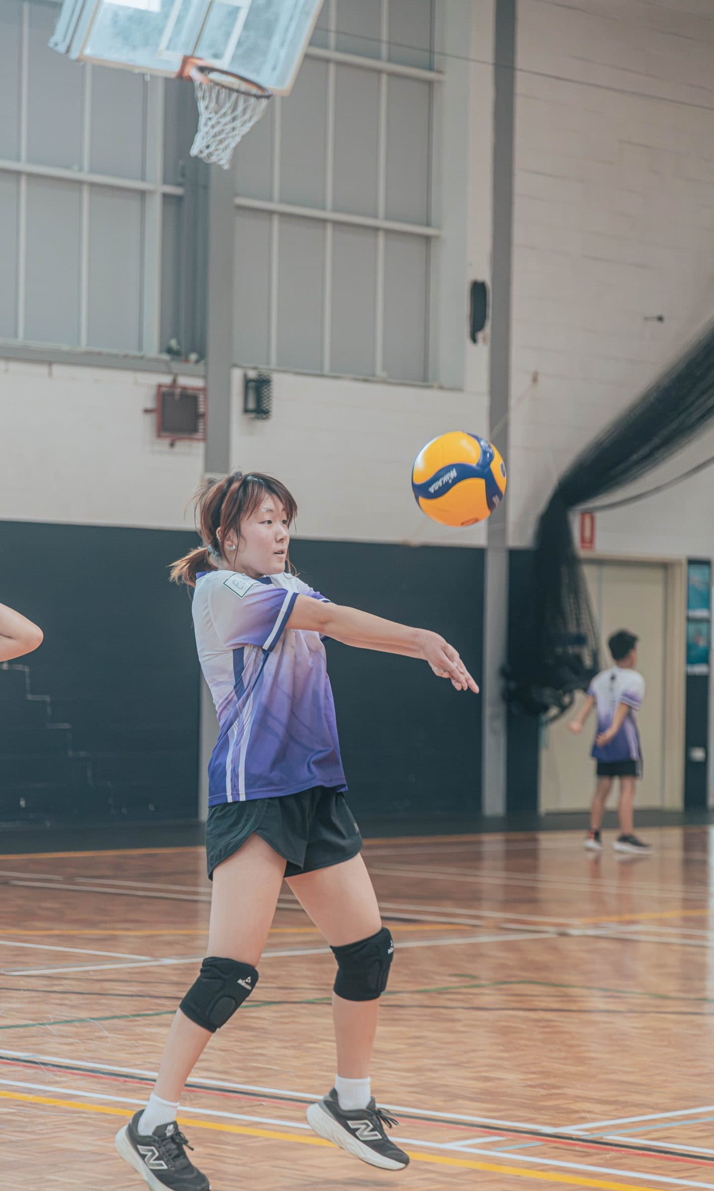 Girl in an Obsidian jersey passing a volleyball at Ryde Aquatic Leisure Centre