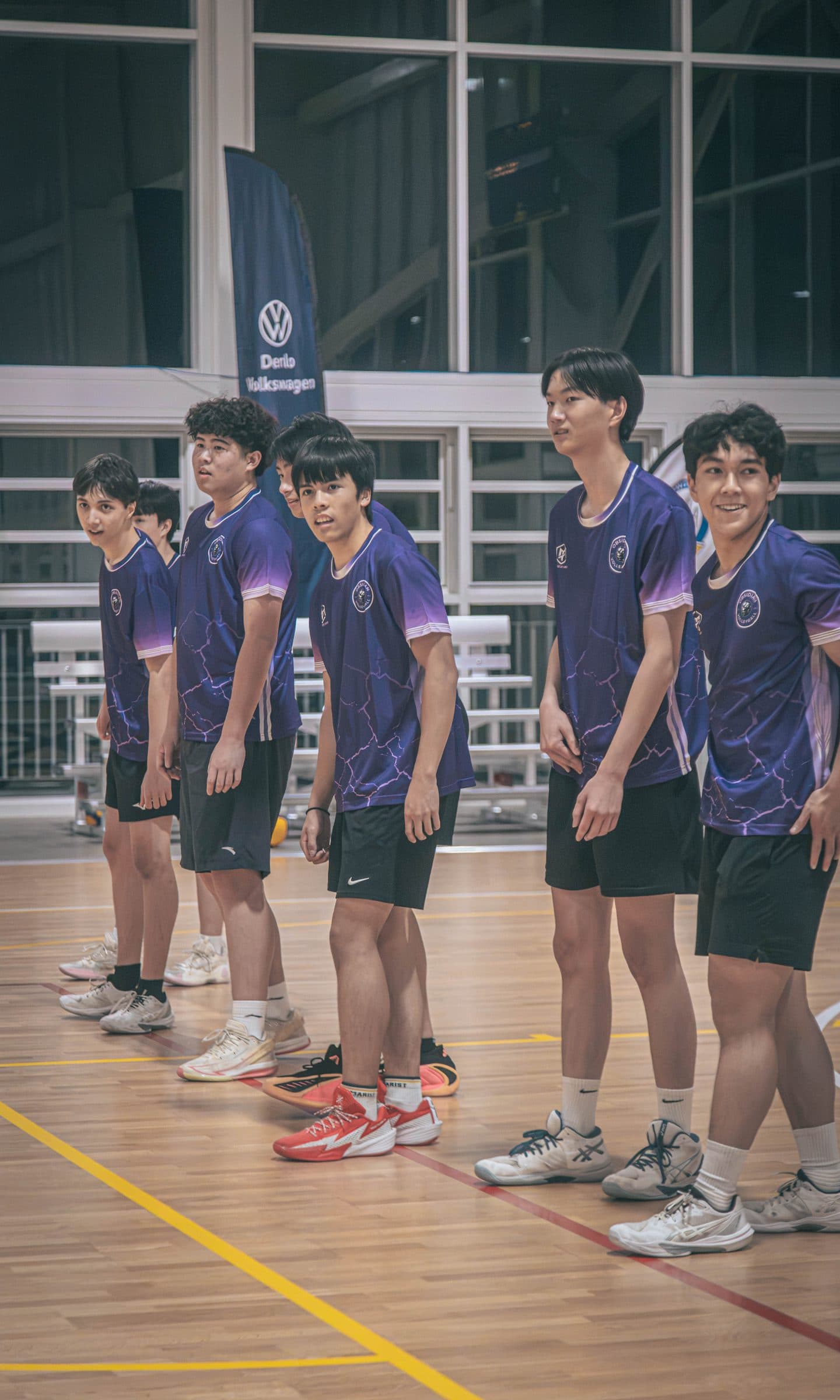 Line of Performance Squad players in purple Obsidian shirts standing on court at West Ryde